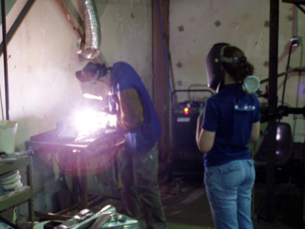 Sculpture Student Observes Plasma Cutting